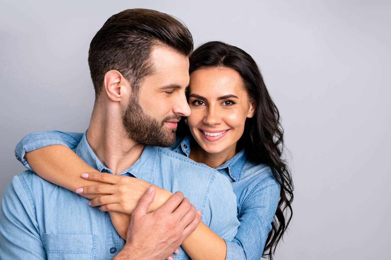 woman hugging man with beautiful hair