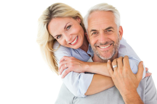 woman hugging man around neck